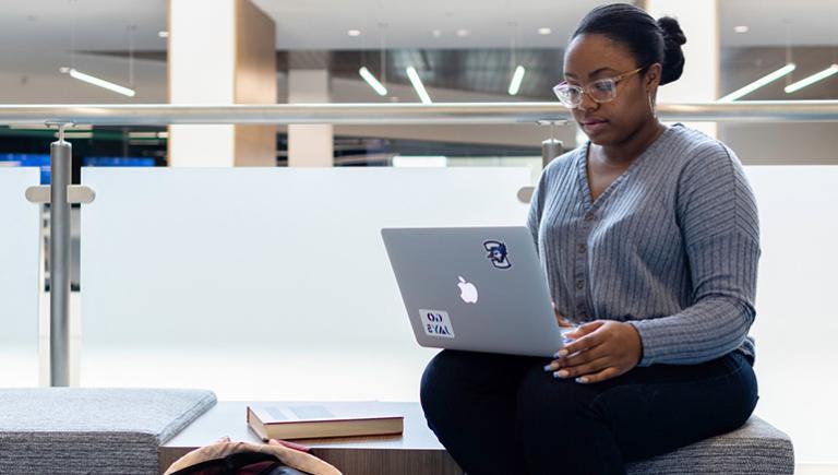 Graduate student on laptop